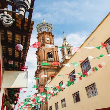 Church Steeple and Flags in street